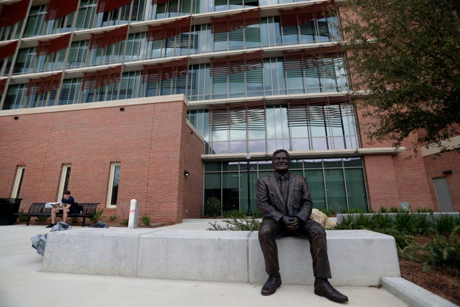 A statue outside the new Earth, Ocean, Atmospheric Science Building honors former FSU President Eric Barron