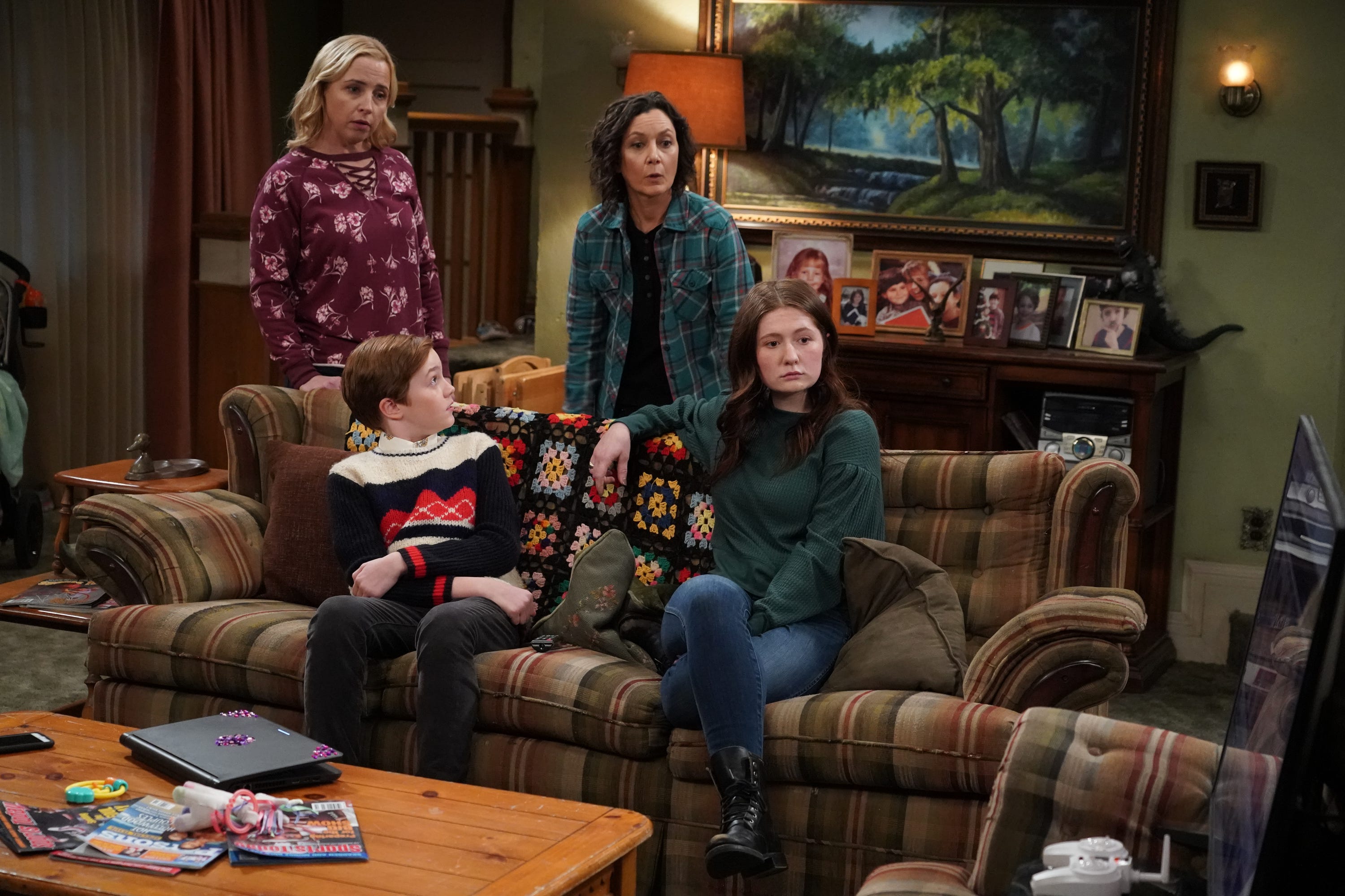 Becky (Lecy Goranson), left, Mark (Ames McNamara), Darlene (Sara Gilbert) and Harris (Emma Kenney) watch live news coverage of the New Hampshire presidential primary during Tuesday's live episode of ABC's 'The Conners.'