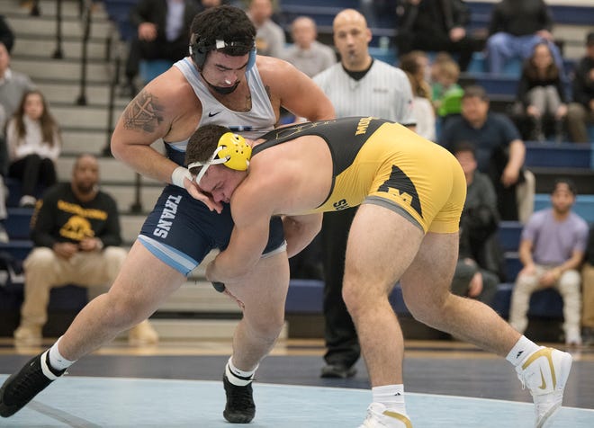 Moorestown’s Rob Damerjian, right, takes down Highland’s Josh Ortiz during the 220 lb. bout of the  South Jersey Group 4 semifinal wrestling match held at Highland High School on Wednesday, February 12, 2020.   Damerjian defeated Ortiz, 17-6. 