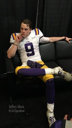 LSU quarterback Joe Burrow smokes a cigar after defeating Clemson in the national championship game on Jan. 13.
