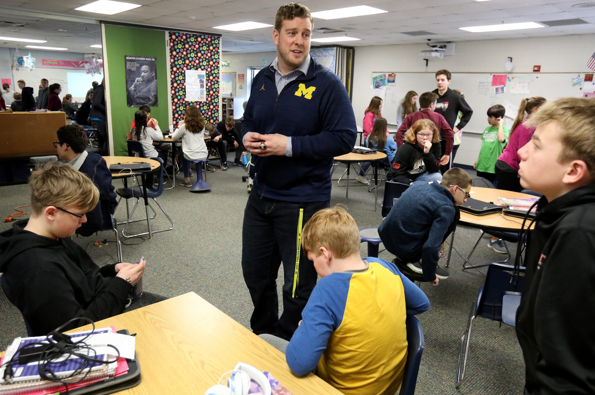 After his presentation former Michigan football player Will Heininger talks with seventh grade students at Mill Creek Middle School in Dexter, Michigan on Thursday, January 30, 2020.
Heininger suffered from depression and thoughts of suicide during his playing career at Michigan. With help he overcame that and now he works and talks with students to teach them how to talk about and deal with these kind of issues at an early age.