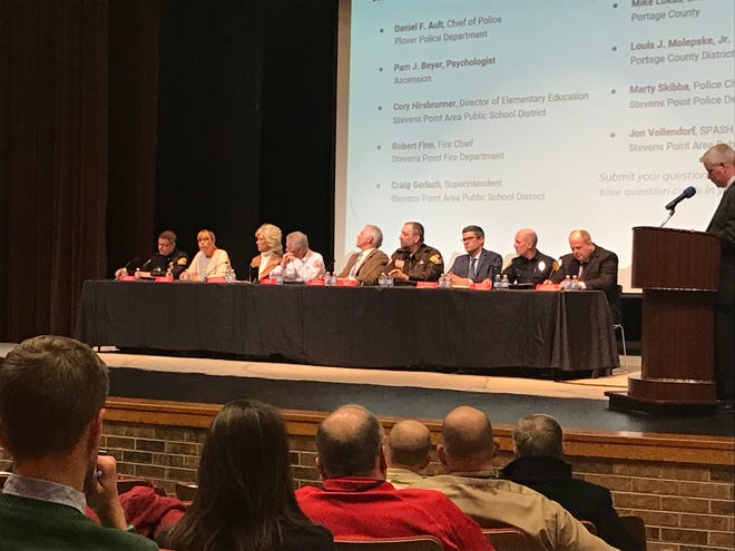 A panel of Stevens Point area school, police and health officials answer questions from attendees Wednesday during a school safety community meeting Wednesday at the Stevens Point Area High School.