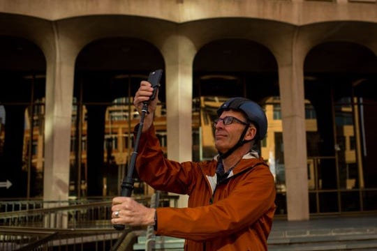 Chuck Emmert, Video Production Coordinator for the city of Phoenix, shows where he takes photos for the city's Instagram account Friday, January 24, 2020 near Phoenix City Hall.
