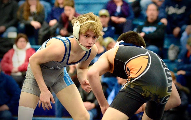 Richmond's Noah Harris faces Almont's Dallas Stanton during the Division 3 wrestling districts on Wednesday, Feb. 12, 2020, at Richmond.