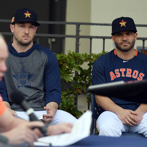 Alex Bregman and Jose Altuve listen as owner Jim C