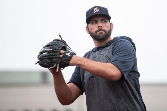 Pitcher Michael Fulmer makes a throw during Detroit Tigers spring training at TigerTown in Lakeland, Fla., Friday, Feb. 14, 2020.