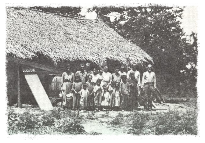 Houma Indians in Terrebonne Parish in 1907. These houses are similar to those built and lived in on Isle De Jean Charles, residents say. United Houma Nation tribe members still live on the island and in surrounding areas.