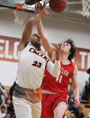 Fern Creek's Nazir Ahmad (23) was fouled by Butler's Cameron Underwood (11) during their game at Fern Creek High School in Louisville, Ky. on Feb. 13, 2020.