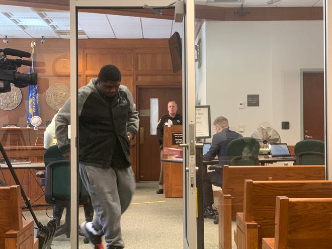 Tyrone Smith, the 18-year-old Waukesha South High School student charged with felony reckless endangerment for a Dec. 2, 2019, gun incident at the school, emerges from the courtroom at the Waukesha County Courthouse on Feb. 14, 2020. The court declined to dismiss the felony charge during a preliminary hearing.