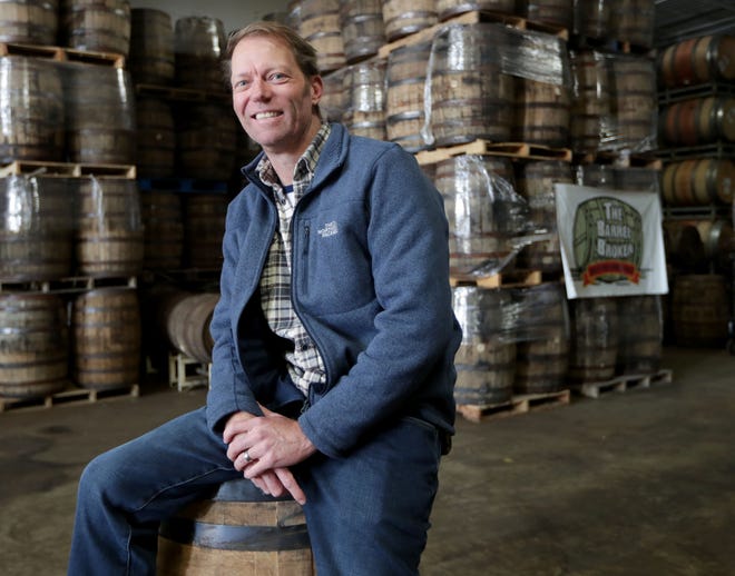 John Gill is called The Barrel Broker. He buys barrels from distilleries and wineries and sells them to breweries and other businesses. Part of the job is keeping up with a Menomonee Falls warehouse filled with empty barrels.