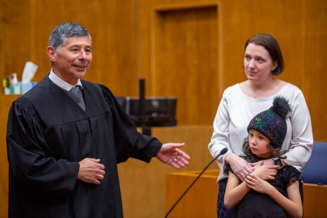 Marion County Judge Manuel Perez thanks his family, Whitney and Roxie Perez, as he's sworn in to the Marion County Circuit Court by Judge Channing Bennett on Feb. 13, 2020.