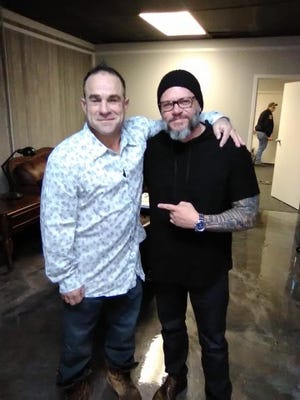 John Stark (left) poses with  Pastor John Alarid of Freedom City Church in this 2018 photo. Stark's body was found Wednesday near the Veterans Coming Home Center, a drop-in center for homeless people. Police are investigating but say Stark's death does not appear to be suspicious.