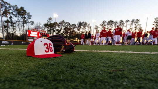 A cap honoring former coach Tony Robichaux, who wore the number 36, is shown before the Cajuns' 2020 season opener.