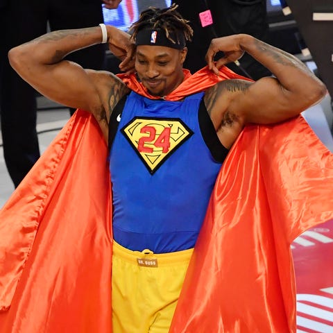 Dwight Howard puts on a Superman costume in the sl