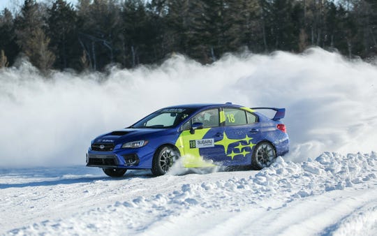 A Subaru WRX STI at full chat across the ice on Wisconsin's Dollar Lake. Though still based on the Impreza's last-gen chassis (new bones should come in 2021), the STI is one of the most capable compact cars on the planet.  