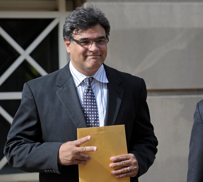 In this Oct. 23, 2012, file photo, former CIA officer John Kiriakou leaves the U.S. District Courthouse in Alexandria, Va.