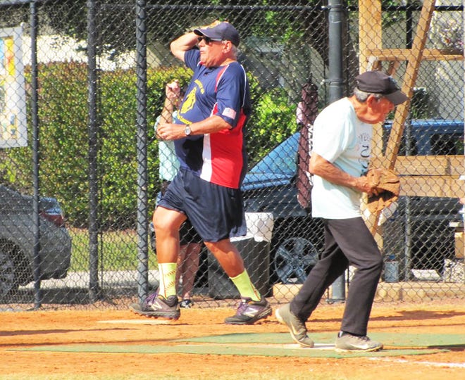 Rick Condle of the American Legion Post is out by less than half a step as Doreenâ€™s Bill Moors makes the put out at home plate.
