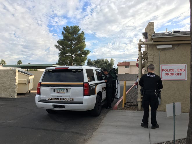 Police officers deliver a patient who is having a psychiatric crisis to Recovery Response Center in Peoria. Nationwide, other states are emulating a crisis response model developed in Arizona.