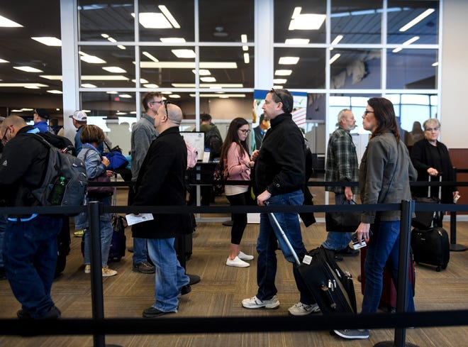 Passengers wait to board their flights on Wednesday, Feb. 19, 2020 at the Sioux Falls Regional Airport.  