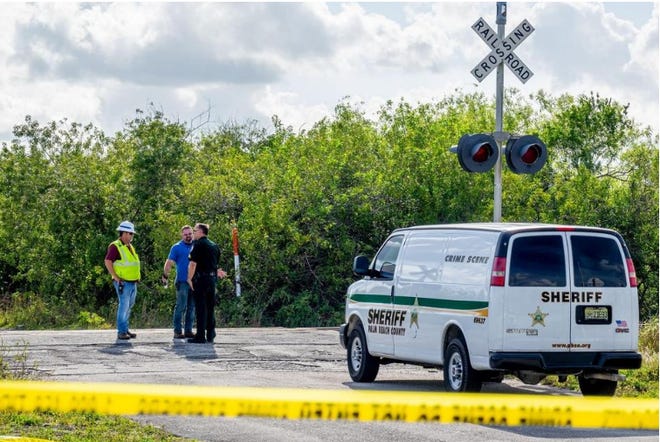 Authorities investigate the scene where a pedestrian was hit and killed by a northbound Amtrak train north of the intersection of Bee Line HIghway and Indiantown Road in Jupiter Feb. 18, 2020.