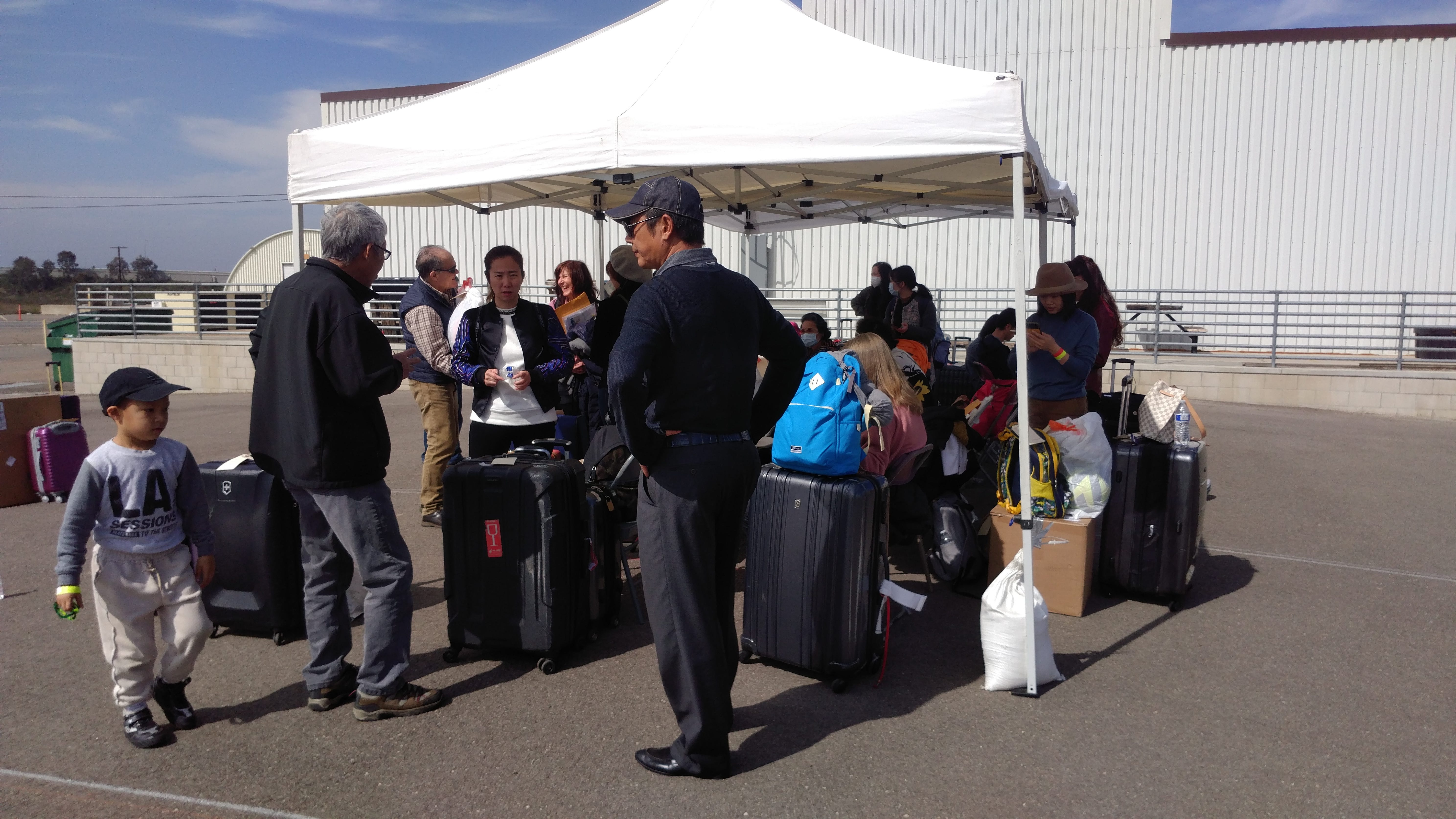 Evacuees at Marine Corps Air Station Miramar prepare to leave quarantine on Feb. 18, 2020.