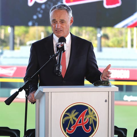 Rob Manfred takes questions during a Sunday press 