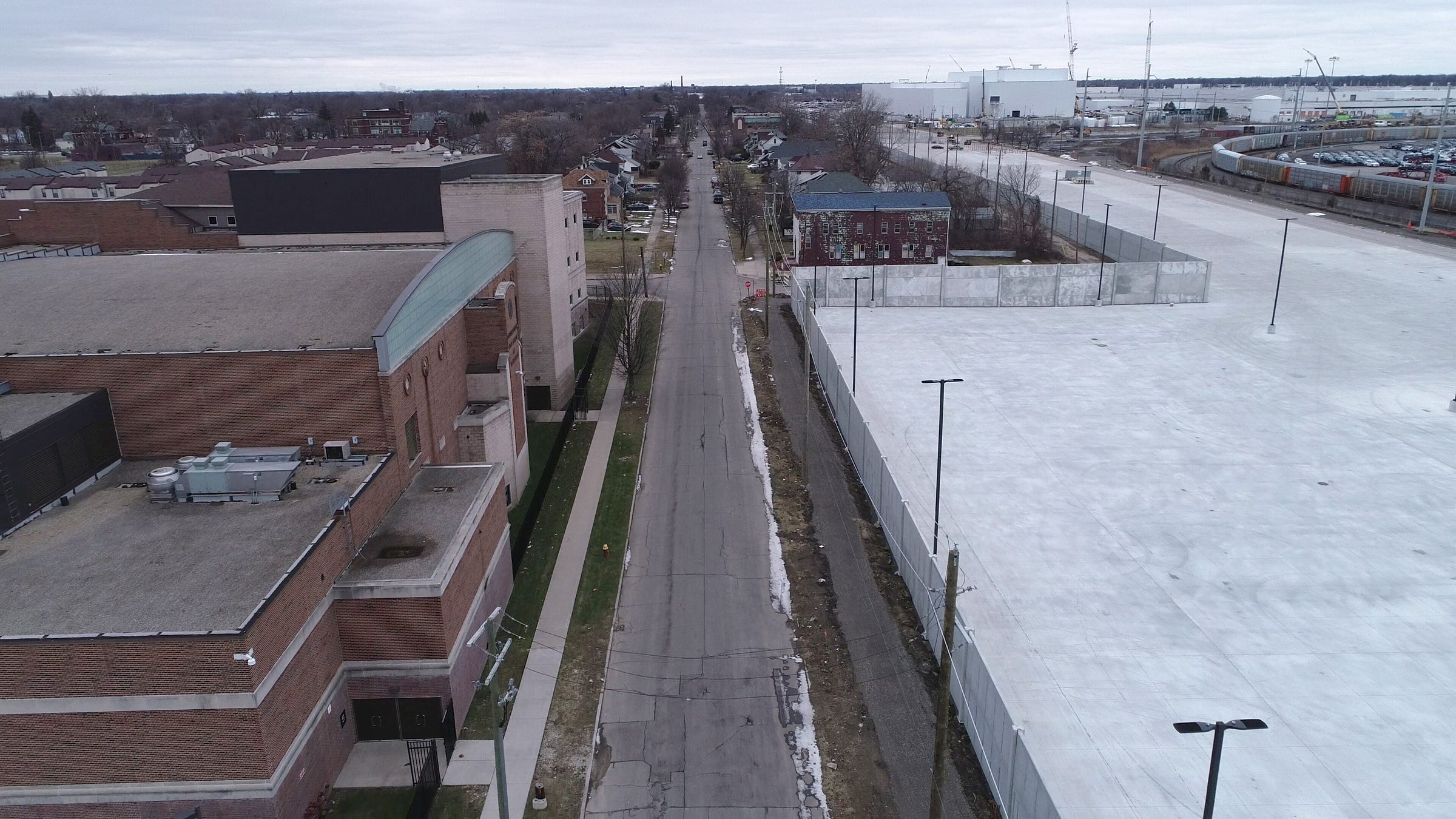 Aerial images show the new wall built around FCA's Jefferson North Assembly Plant along Beniteau Street on Detroit's east side in January.  Southeastern High School of Technology and Law can be seen at left.