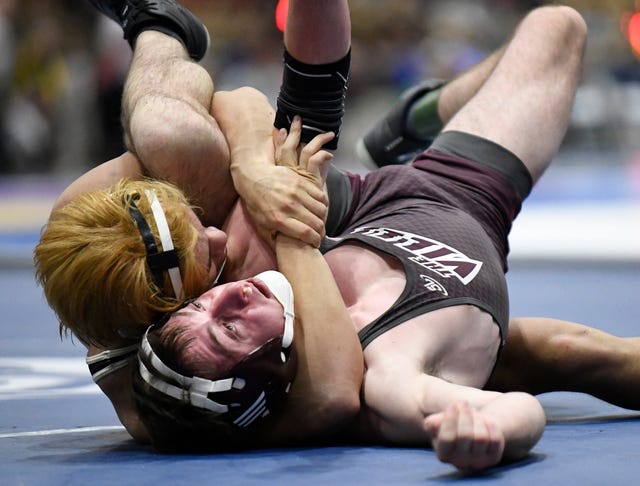 Collierville’s Logan Sprague tries to keep from being pinned by Rossview’s Aaron Pardo during the TSSAA individual wrestling state championships at Williamson Co. Ag Center Thursday, Feb. 20, 2020 in Franklin, Tenn.