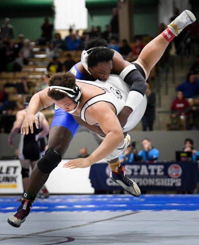 Brentwood’s Skylar Coffey slams Tullahoma’s Tydrell Mitchel to the mat during the TSSAA individual wrestling state championships at Williamson Co. Ag Center Thursday, Feb. 20, 2020 in Franklin, Tenn.