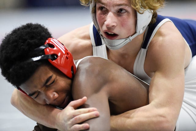 Independence’s Tanner Willett (top) wrestles Roman Evans of Ooltewah during the TSSAA individual wrestling state championships at Williamson Co. Ag Center Thursday, Feb. 20, 2020 in Franklin, Tenn.