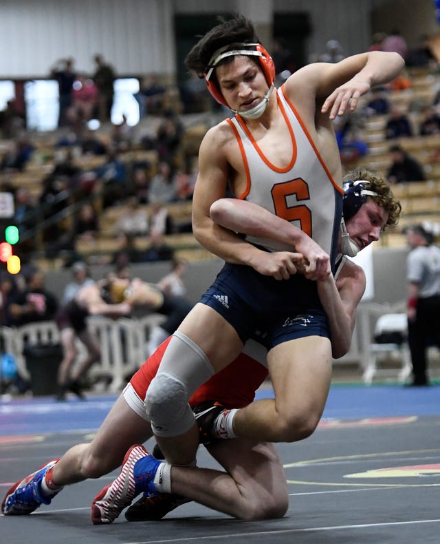 Oakland’s Evan Harris takes Summit’s Miles Grady to the mat during the TSSAA individual wrestling state championships at Williamson Co. Ag Center Thursday, Feb. 20, 2020 in Franklin, Tenn.