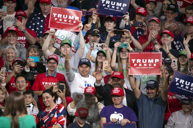 Trump supporters react as Donald Trump Jr. speaks during a rally that President Donald Trump spoke at the Arizona Veterans Memorial Coliseum in Phoenix on Feb. 19, 2020.