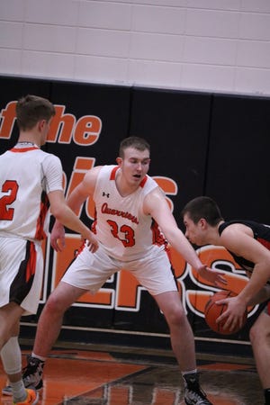 Ramsey Heinecke defends against his former team, Sisseton, on Tuesday, Feb. 18 in Dell Rapids.