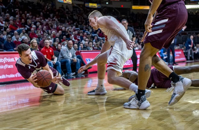 Missouri State senior Ross Owens dives for the ball on the court in a matchup against Bradley on Feb. 19, 2020, in Peoria, Illinois.