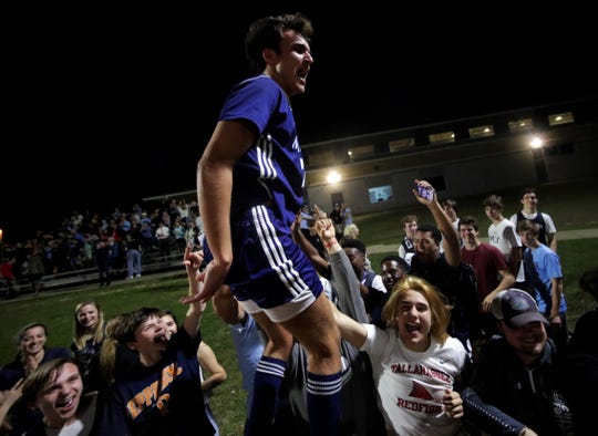 Maclay junior Mateus Bitencourt celebrates with the Marauders' fans after Maclay's boys soccer team beat St. Johns Country Day 2-1 in a Region 1-2A final on Feb. 19, 2020.