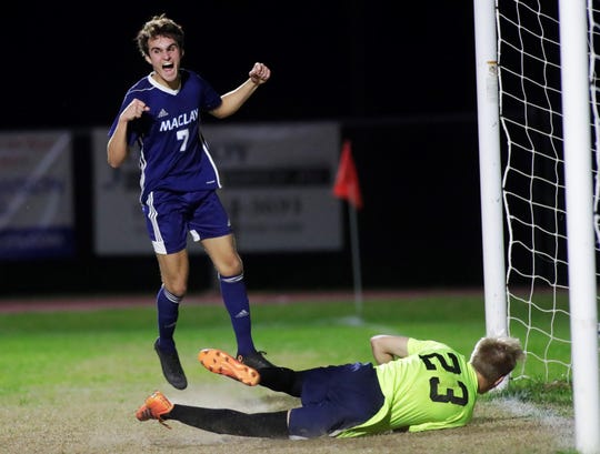 Maclay junior Mateus Bitencourt celebrates Michael Sweeney's game-winning goal as Maclay's boys soccer team beat St. Johns Country Day 2-1 in a Region 1-2A final on Feb. 19, 2020.