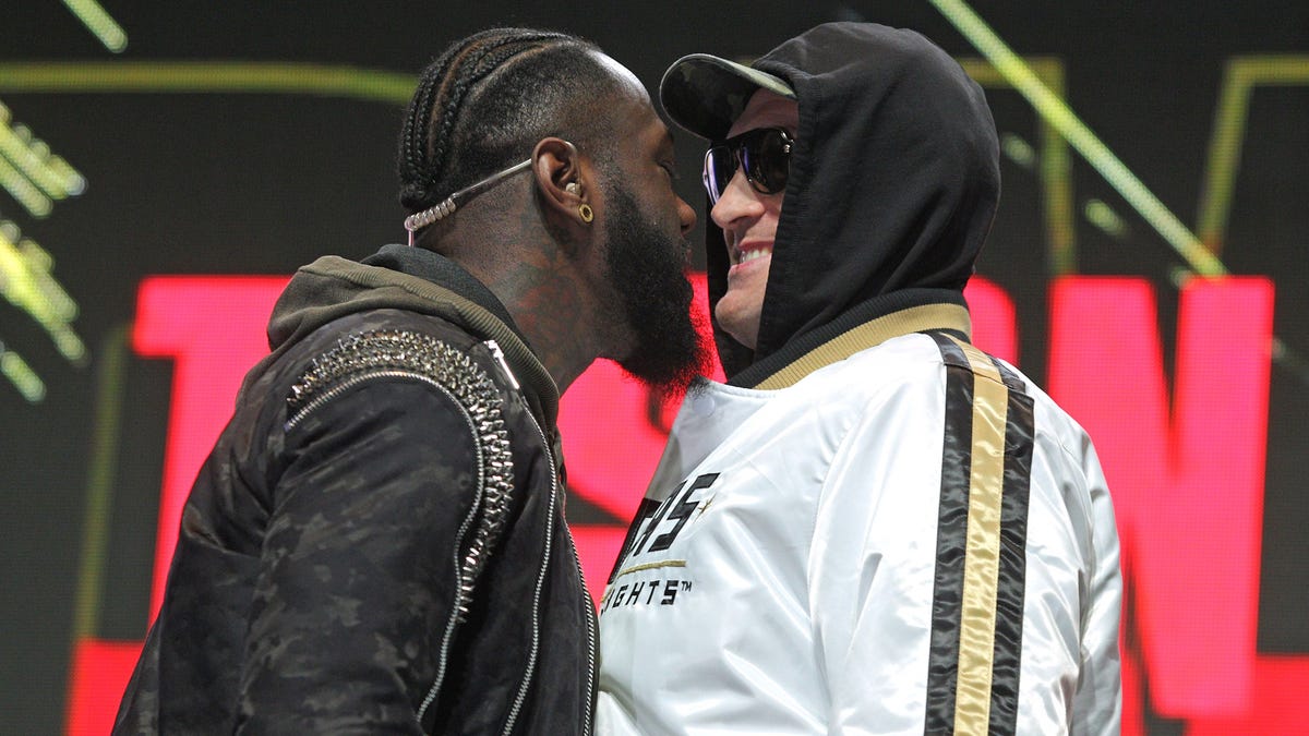 Deontay Wilder, left, and Tyson Fury have a discussion about their Saturday fight in Las Vegas.