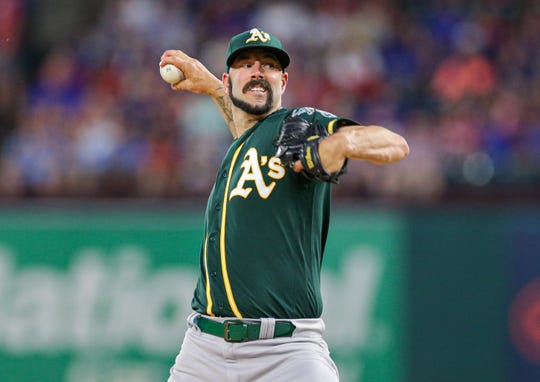 Oakland Athletics starter Mike Fiers (50) throws against the Texas Rangers at Globe Life Park in Arlington.