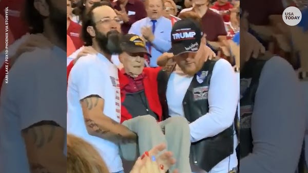 Phoenix Trump rally attendees carry 100-year-old W