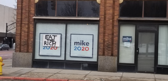 A sign saying “Eat the rich” was attached to Democratic presidential candidate Mike Bloomberg’s Flint office on Feb. 16, according to his campaign.