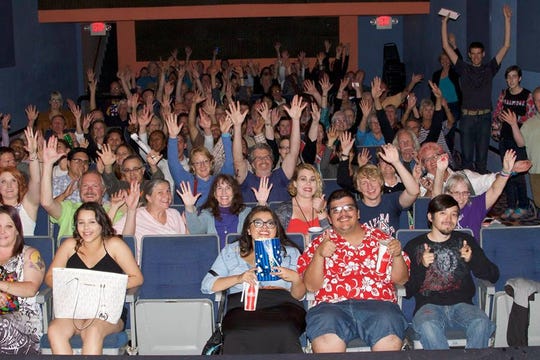 Audience members celebrate at The Screening Room during the 2016 Arizona International Film Festival.