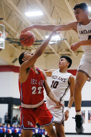 Bel Air's Tony Brown goes against Ysleta defense during the game Friday, Feb. 21, at Hanks High School in El Paso. Ysleta won  52-49 against Bel Air. Ysleta advanced to play Parkland.