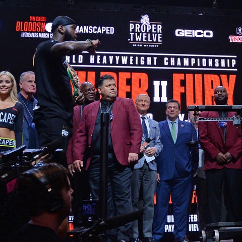 Deontay Wilder and Tyson Fury at Friday's weigh-in