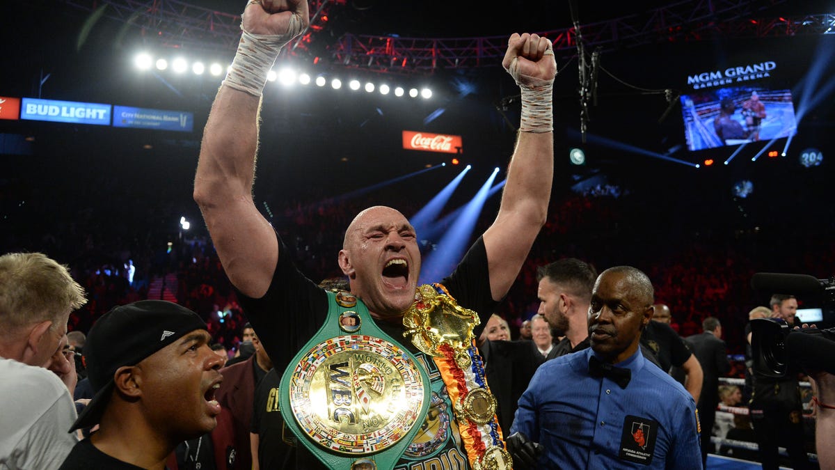 Tyson Fury celebrates after defeating Deontay Wilder in their WBC heavyweight title bout.