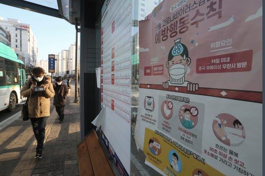 A poster detailing precautions to take against the coronavirus is seen at a bus station in Goyang, South Korea, on Feb. 23, 2020. The signs read "Precautions against the coronavirus."