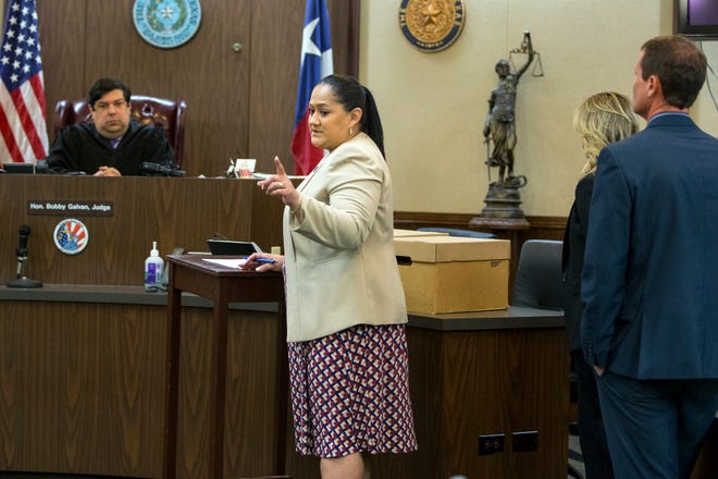 94th District Court Judge Bobby Galvan listens to Prosecutor Angelica Hernandez before the jury is brought in for the start of the capital murder trial in February 2020.