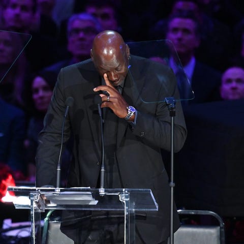 NBA legend Michael Jordan sheds tears during the m