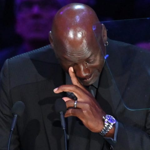 NBA legend Michael Jordan sheds tears during the m