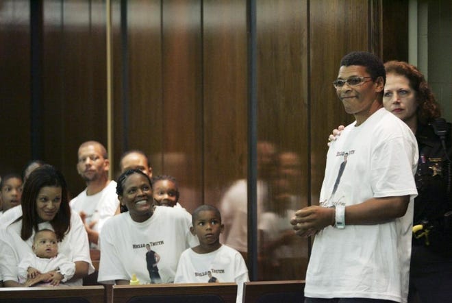 Greeted by family members wearing shirts saying "Hello Truth," Robert McClendon of Columbus walks into a courtroom in 2008 moments before being freed after serving 18 years in prison for a rape he did not commit.