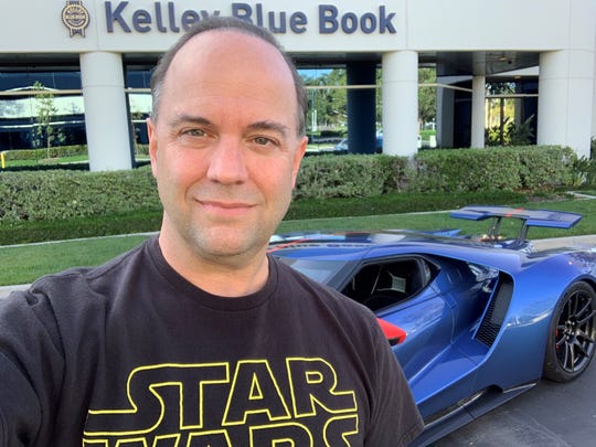 Karl Brauer, executive editor of Kelley Blue Book, urges people to consider car colors other than white, black and silver. He took this photo in Irvine, California on May 3, 2019.